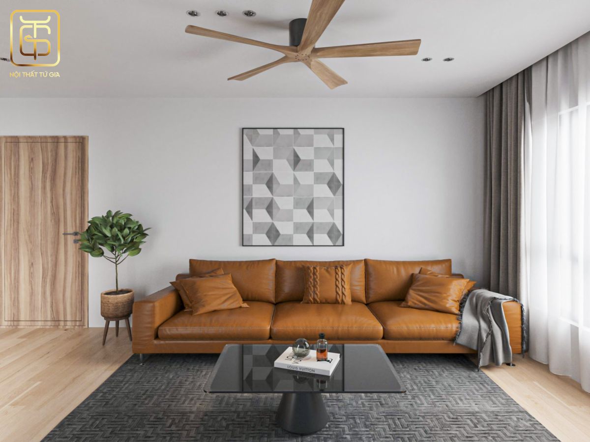 Bộ sofa bọc da màu cam tạo điểm nhấn cho không gian phòng khách căn hộ