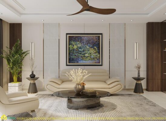 Sofa bọc da màu kem với thiết kế bo cong nhẹ nhàng, tạo cảm giác thư giãn