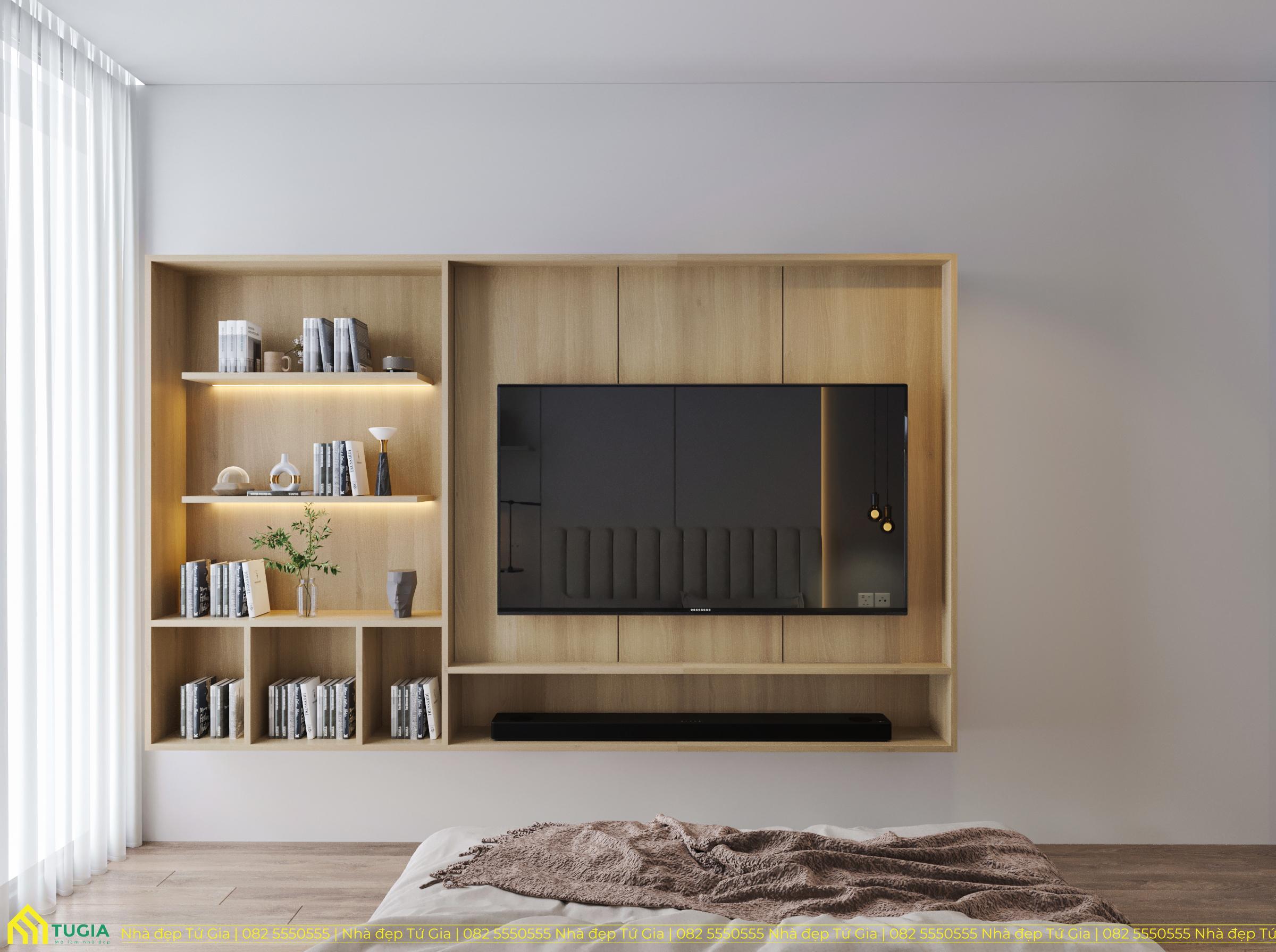 Kệ sách kết hợp với kệ ti vi treo tường âm giúp căn phòng tăng thêm diện tích sử dụng