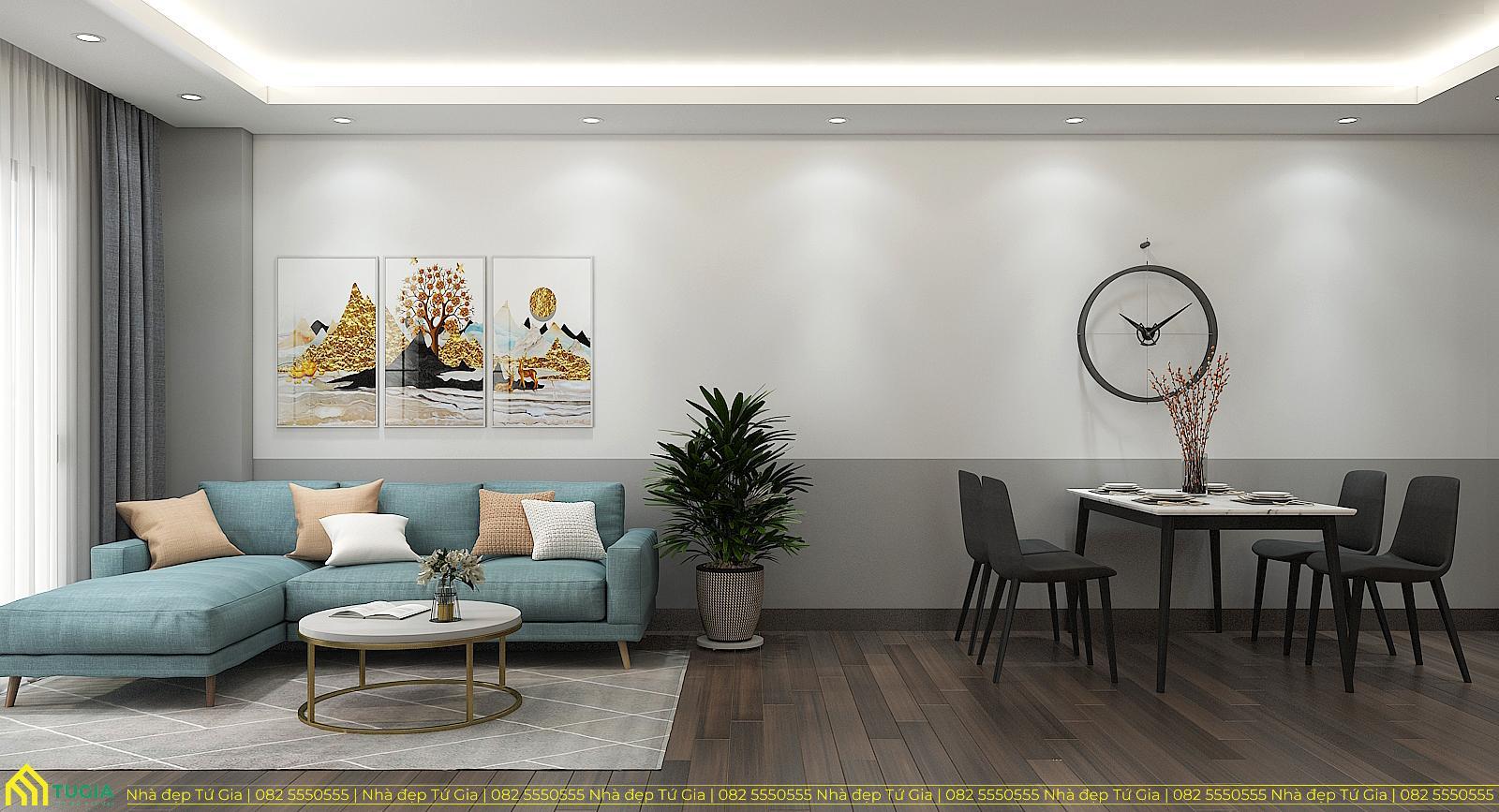 Không gian phòng khách được bố trí đơn giản với sofa chữ L đặt sát tường kết hợp bàn trà nhỏ gọn