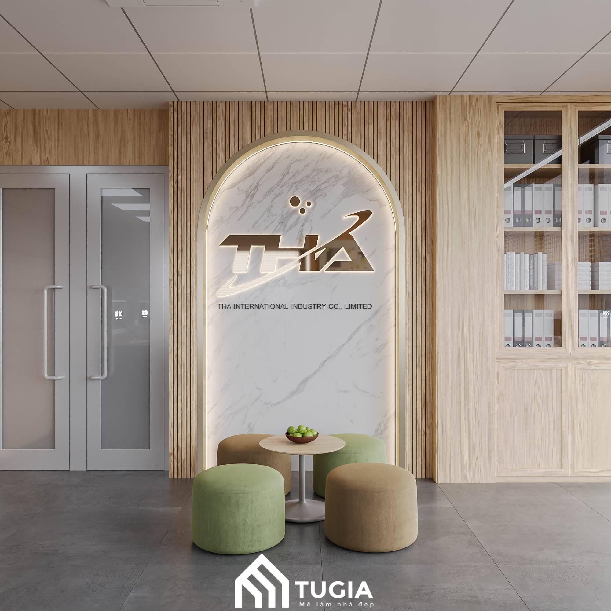 Khu vực sảnh chờ với điểm nhân là vách tường ốp đá trắng mái vòm với logo công ty được chiếu sáng