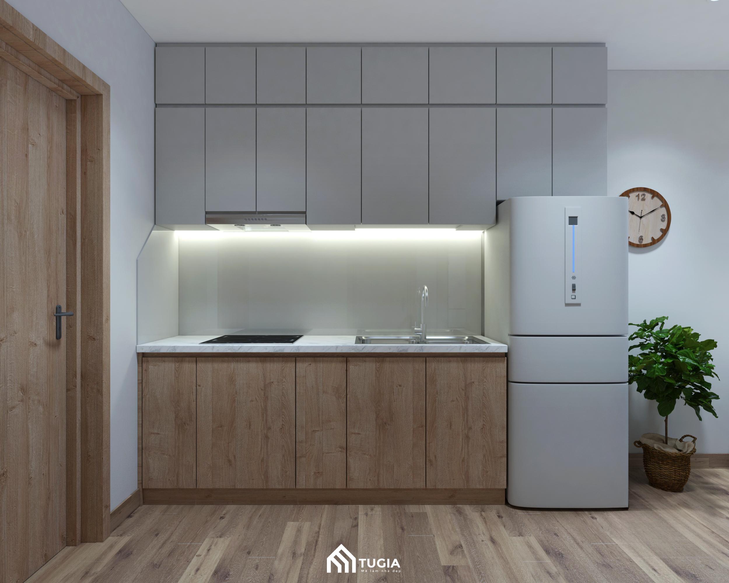 Không gian nấu nướng nhỏ gọn mà tiện nghi với hệ tủ bếp gỗ công nghiệp hiện đại