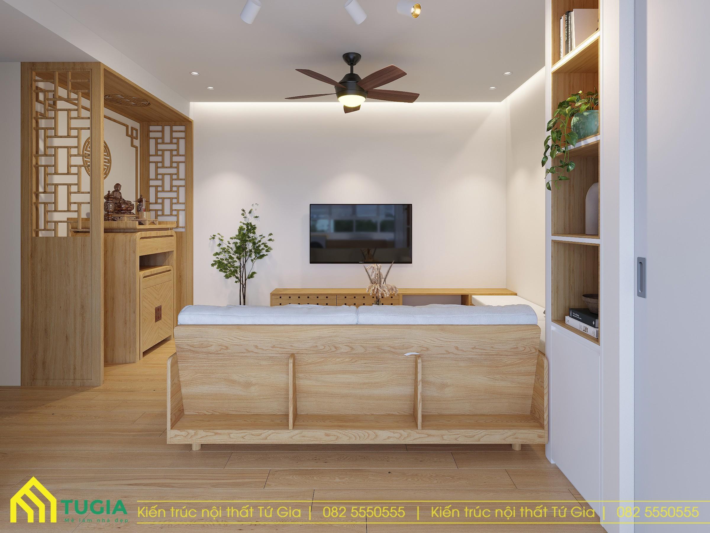 Tích hợp khu vực thờ ngay tại phòng khách với bàn thờ đứng có vách ngăn đảm bảo sự trang nghiêm