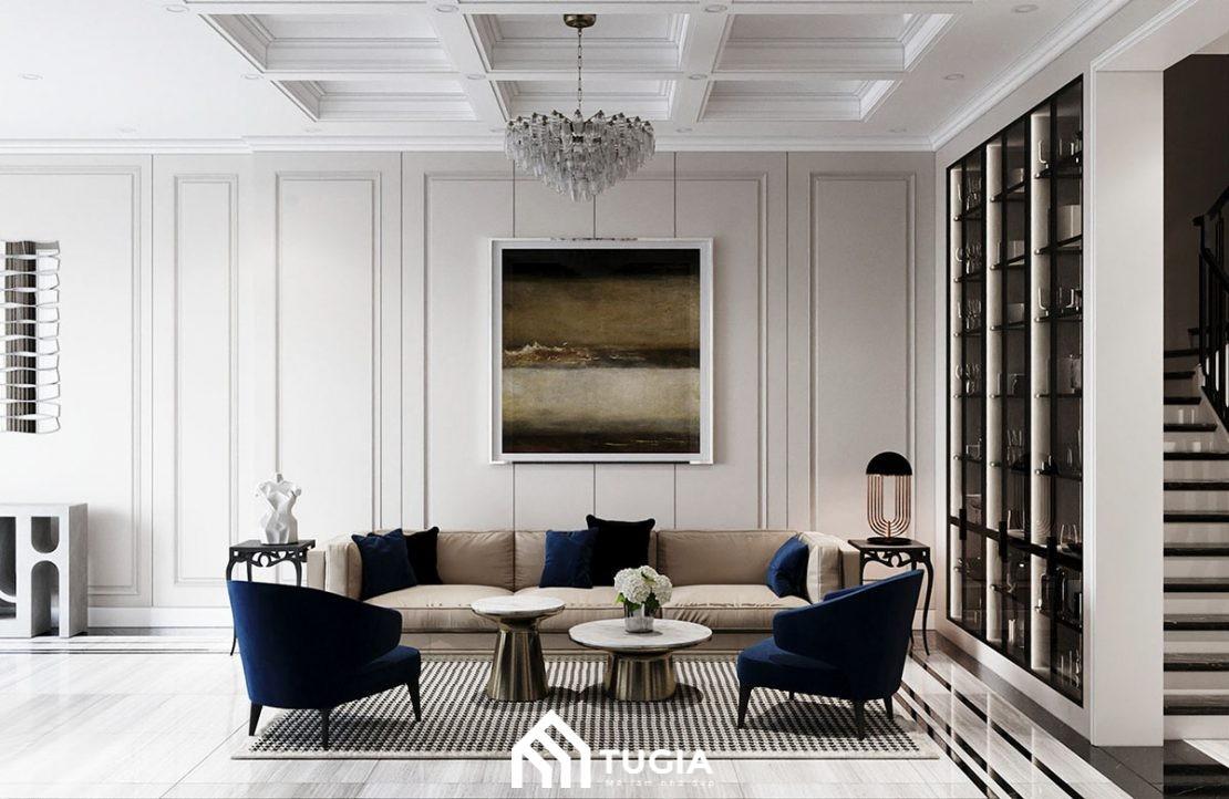 Phòng khách bố trí sofa và bàn trà dạng thấp giúp mở rộng lối đi trong không gian nhà ống có chiều ngang hạn chế