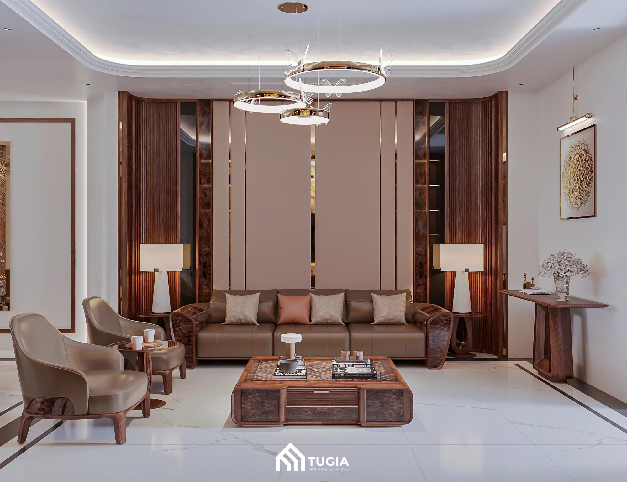 Khu vực phòng khách được bố trí chiếc sofa dài bọc da màu nâu đất hoặc màu caramel, tạo sự bề thế và ấm áp