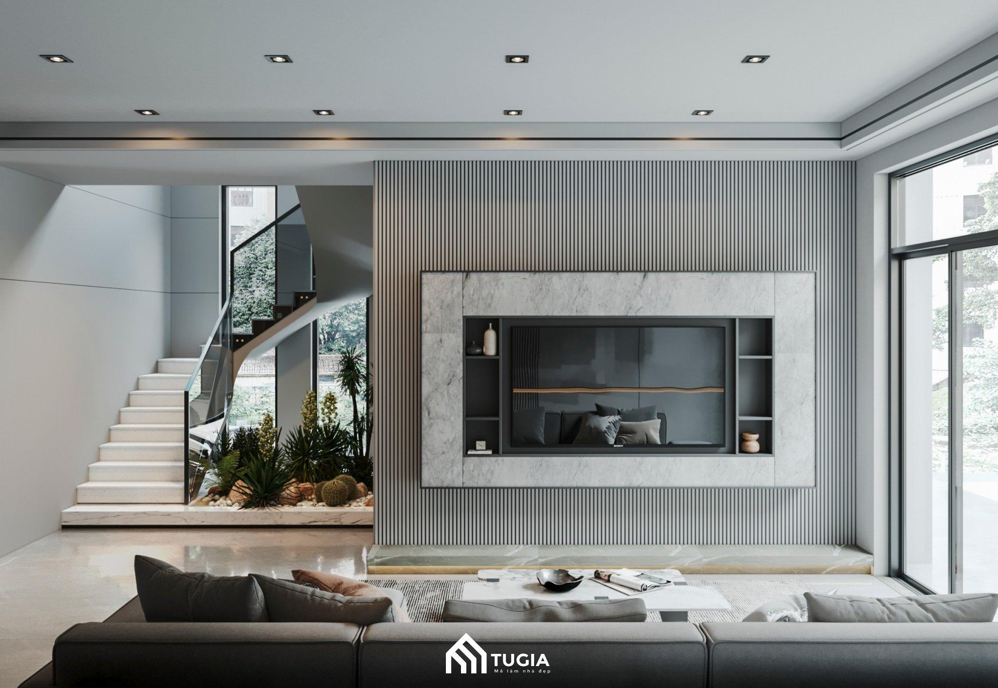 Căn phòng khách nhà phố được thiết kế theo phong cách hiện đại rất thu hút nhờ bộ sofa cao cấp kết hợp vách tivi trang trí tạo điểm nhấn
