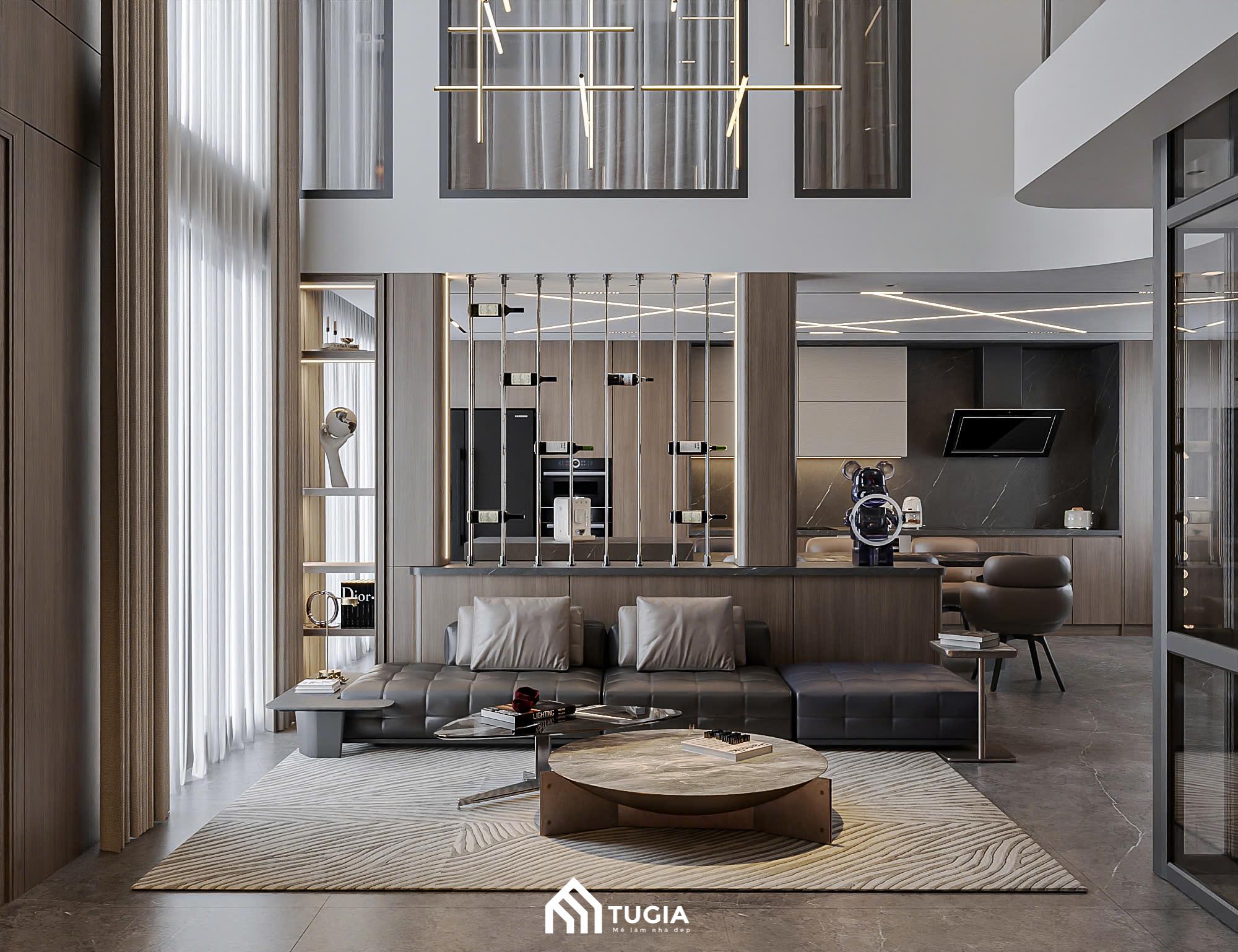 Bộ sofa dáng dài, tone xám, đi cùng bàn trà mặt đá bo cong, tạo nên một tổng thể vừa hiện đại vừa mềm mại