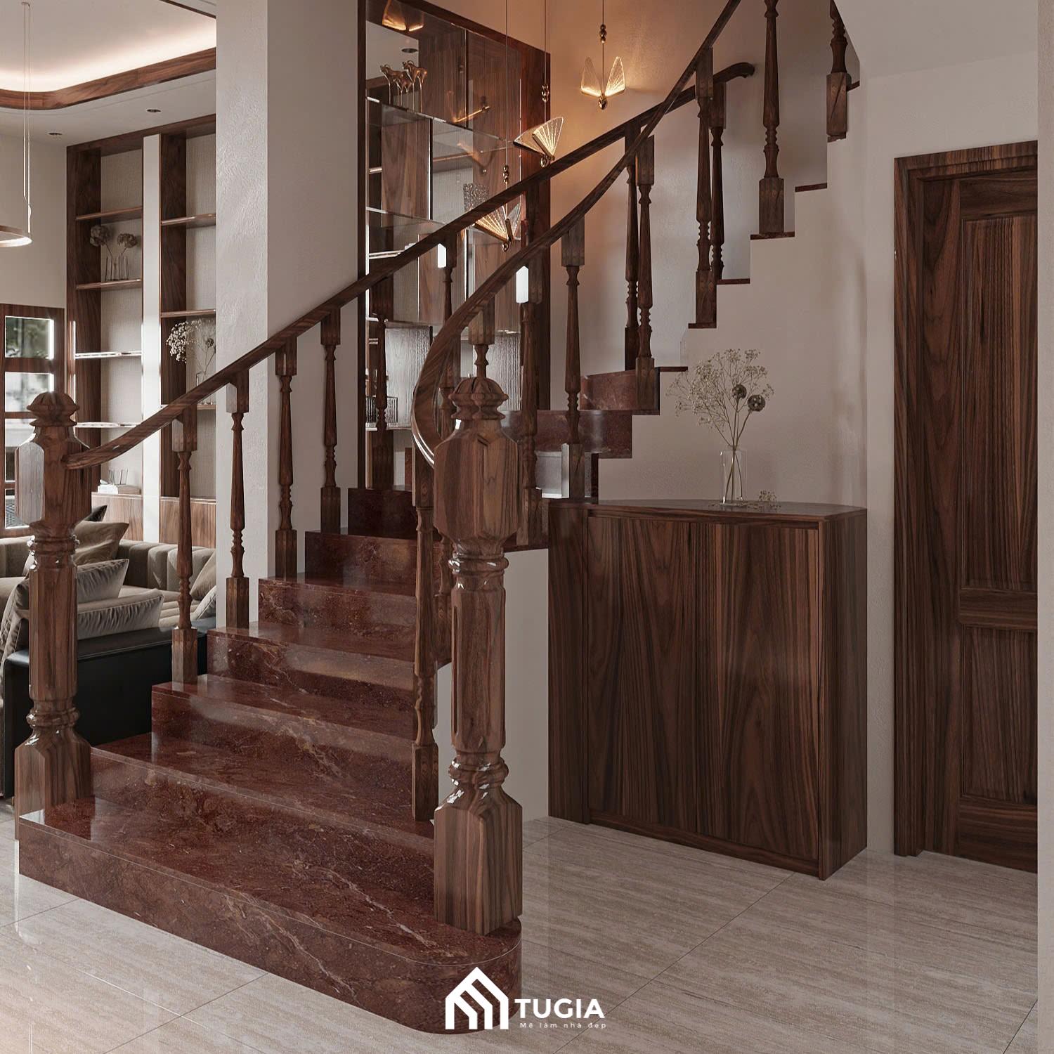 Cầu thang của căn nhà được hoàn thiện với lan can bằng gỗ tự nhiên kèm gạch giả đá màu nâu gỗ tạo sự đồng nhất