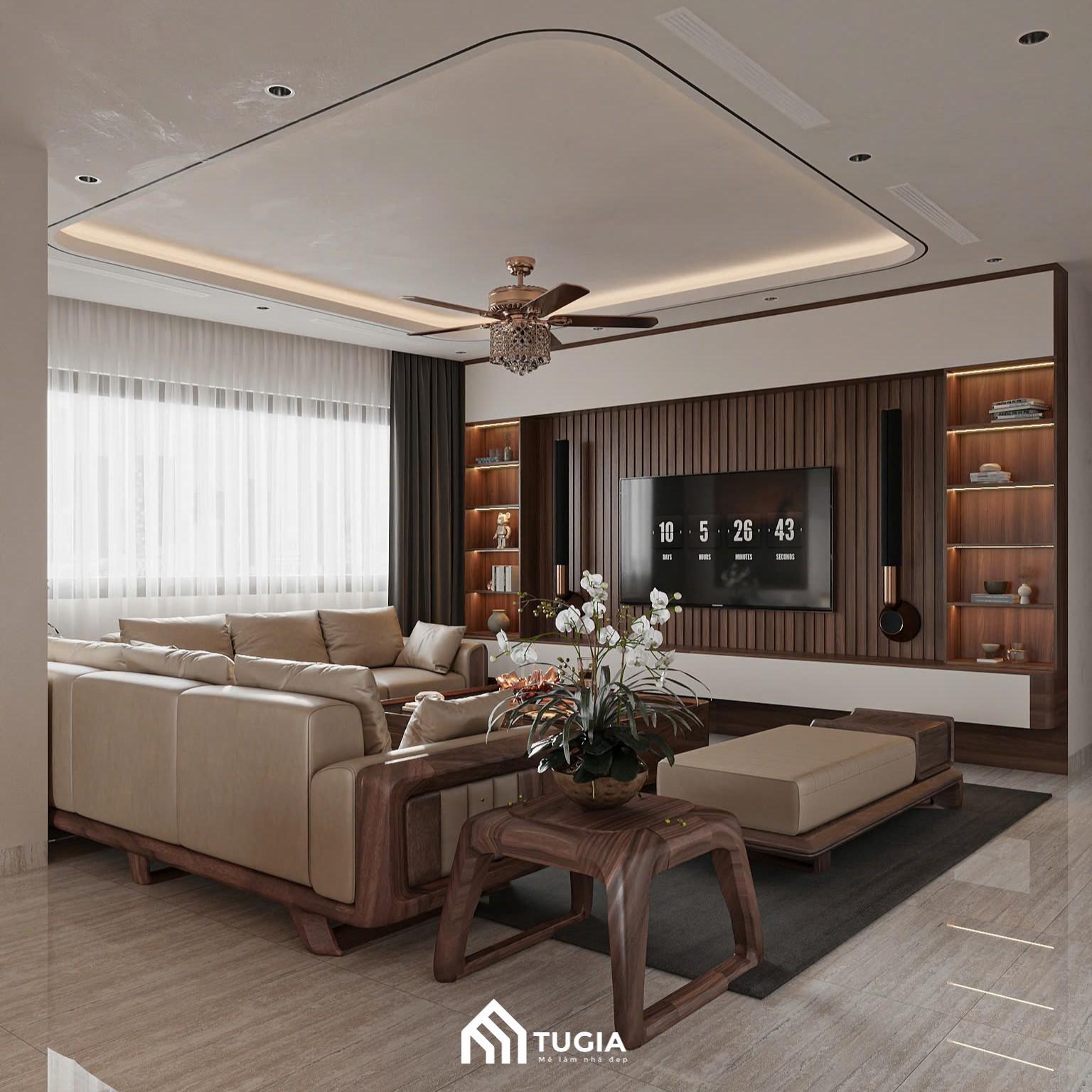 Trần thạch cao giật cấp nhẹ, kết hợp quạt trần và ánh sáng gián tiếp, giúp phòng khách luôn thoáng đãng, mát mẻ mà không cần quá nhiều chi tiết trang trí cầu kỳ
