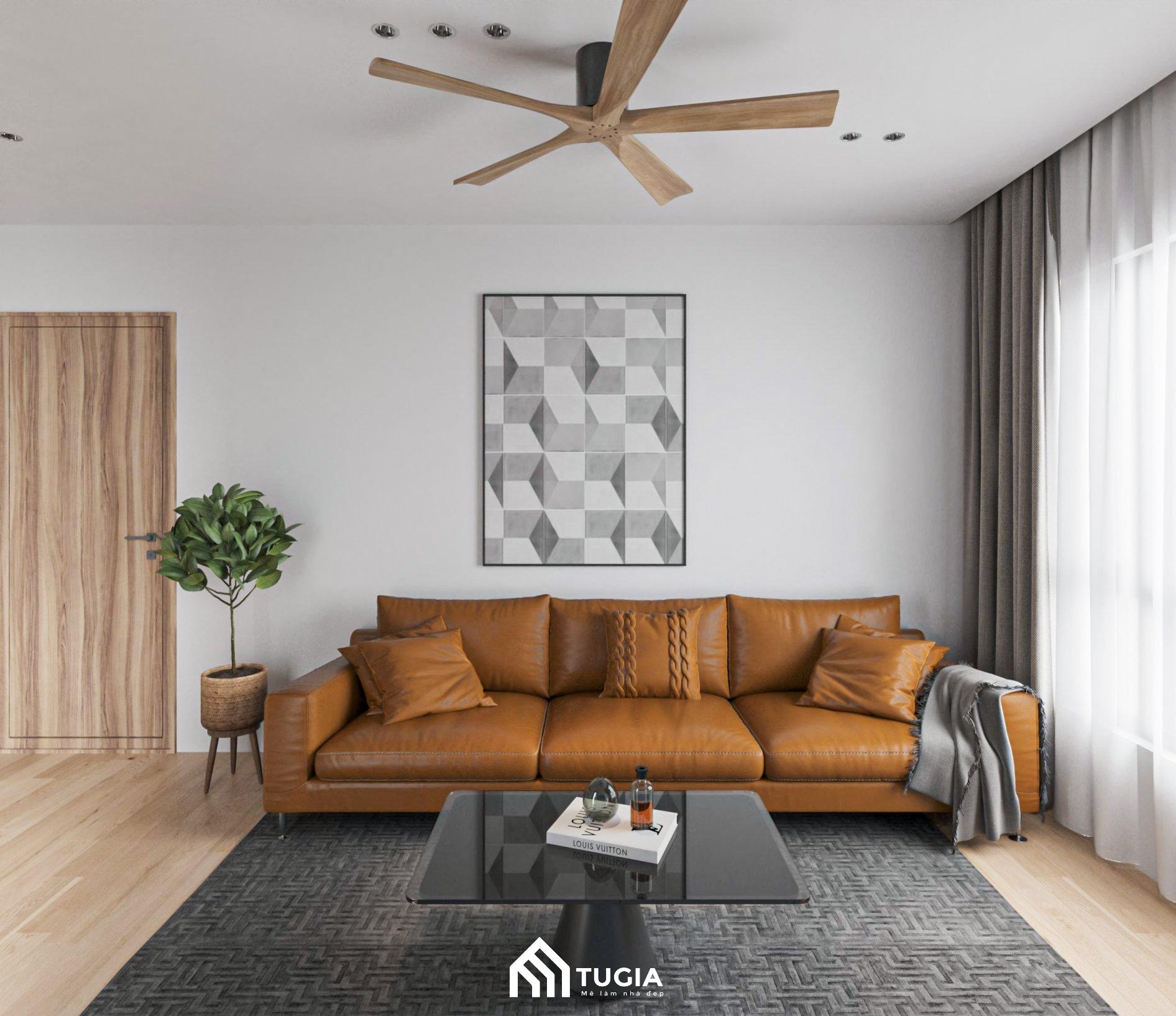 Phòng khách tối giản được bố trí với bộ sofa đơn sắc cùng bàn trà và kệ tivi đơn giản