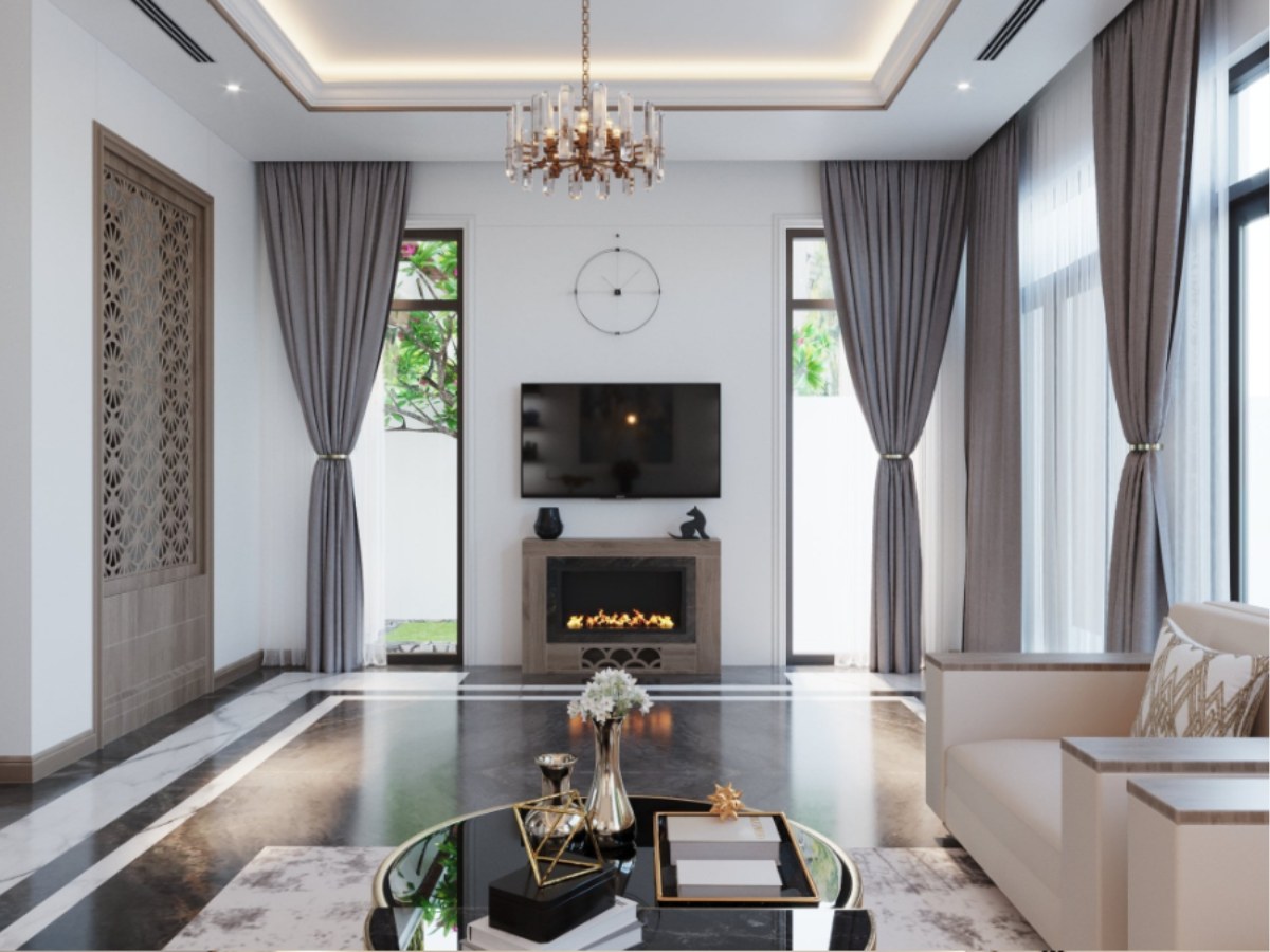Hình ảnh thiết kế nội thất phòng khách hiện đại, sang trọng với bố cục đối xứng. Không gian nổi bật với tivi treo tường phía trên lò sưởi trang trí, hai bên là cửa sổ lớn với rèm xám.