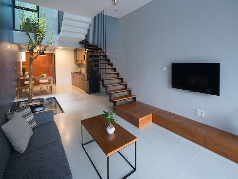 Thiết kế phòng khách tối giản, loại bỏ những đồ nội thất rườm rà, không cần thiết làm không gian thoáng và thoải mái hơn
